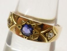 An early 20th Century high grade precious metal Ring, set with two small Rose Cut Diamonds and a