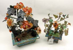 A pair of Oriental Composition/Glass Floral Ornaments, each raised on Cloisonné Planters and