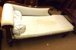 A William IV Mahogany Framed Chaise Longue, upholstered in blue floral fabric (stained), raised on