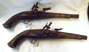 Two Afghan type Flintlock Pistols, metal banded, 10” barrels, 16” overall (A/F)