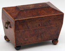 An early 19th Century Burr Walnut Tea Caddy of sarcophagus form, with boxwood stringing and