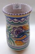 A wide-necked Poole Pottery Vase, typically decorated with coloured floral sprays on a cream