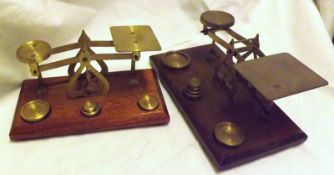 A set of Victorian Brass Postal Scales and a further similar set of later Scales (both with a