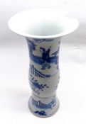 A Chinese Trumpet Vase with flared rim over a balustered body, painted throughout in underglaze blue