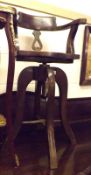 An unusual early 20th Century Revolving Bow Back Chair with cane seat, raised on four swept legs,