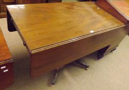 A Victorian Mahogany Pedestal Pembroke Table, of typical form with double drop leaf, single end