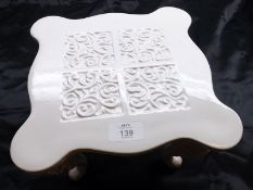 An unusual White Glazed Ceramic Stool on cabriole legs, 10” wide