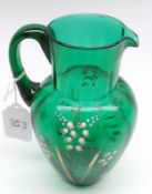A Victorian Green Glass Single-Handled Jug decorated with a painted design of lily-of-the valley,