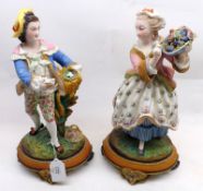 A pair of late 19th Century Continental Parian Ware Figures of boy with birds nest and girl with