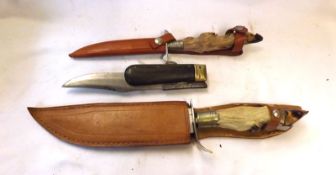 Vintage Clasp Knife, Bowie type blade; together with two Hunting Knives, animal foot grips,