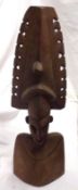 A large Carved African Hardwood Bust, 23” high