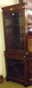 An Edwardian Mahogany Two-Piece Corner Cabinet with astragal glazed doors, and inlaid Sheraton