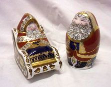 Two Royal Crown Derby Paperweights, one modelled as Santa Clause standing, the other as Santa Clause