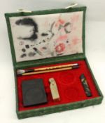 A 20th Century Oriental Boxed Presentation Set, comprising a Table Seal, Brushes, Tablet etc