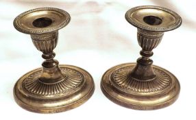 A pair of Edward VII Dressing Table Candlesticks, fitted with removable nozzles, the knopped stems