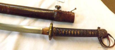 Japanese Sword, cord-bound sharkskin grip, brass tsuba, curved blade, 27 ¾”, leather scabbard