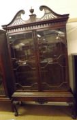 An Edwardian Glazed Mahogany Display Cabinet in Georgian style, large broken arch pediment with