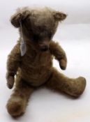 A mid-20th Century Plush Filled Golden Mohair Teddy Bear, with stitched button eyes, silk stitched