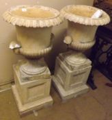 A pair of early 20th Century Painted Terracotta Garden Urns in classical style with shell handles on