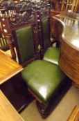 A pair of Victorian Mahogany Dining Chairs with green leather upholstered backs and seat, the