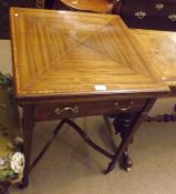 An Edwardian Mahogany Envelope Card Table, the four fold top with inlaid and crossbanded detail, the
