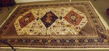 A modern Caucasian Carpet with multi-gull border, central panel of geometric designs and lozenges,