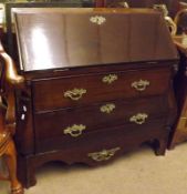 A Dutch Mahogany Bombe Fronted Bureau, the fall front enclosing a fitted stepped interior with