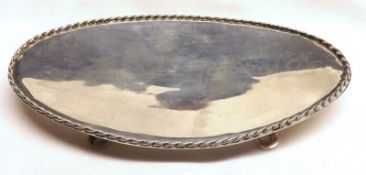 A George V Oval Teapot Stand with gadrooned edge, raised on four small feet, 5 ½” wide, weight