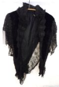 A mid-19th Century Black Velvet Caplet with beadwork detailing to shoulders, edged with black lace