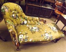 A Victorian Walnut Framed Chaise Longue, with raised buttoned floral upholstered back and seat,