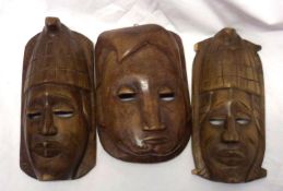 A Group of Three 20th Century Carved Ethnic Masks, largest 10” high (3)