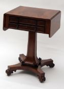 An early 19th Century Rosewood Worktable of rectangular form, fitted on either side with drop