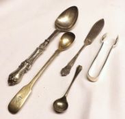 A Mixed Lot comprising: a Victorian Spoon with loaded handle; a pair of Sugar Nips; a Butter