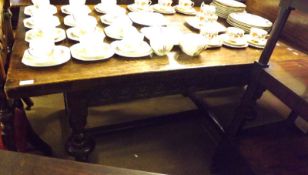 An early 20th Century Oak Refectory type Dining Table of rectangular form, with a rosette moulded