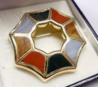 An unmarked yellow metal Shaped Octagonal Open Centred Brooch, set with various coloured Agate
