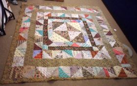 An early 20th Century Welsh Patchwork Quilt with paisley border, 82” x 76”