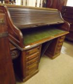 A late 19th/early 20th Century Mahogany Twin Pedestal Roll Front Desk, of typical form, the interior