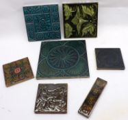 A collection of seven various Majolica Glaze Tiles, in various sizes, all mainly relief moulded with