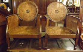 A pair of early 20th Century Mahogany Bergère Chairs, with single caned backs, seats and sides,