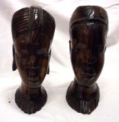 A pair of 20th Century West African Hardwood Busts of male and female heads, 7 ½” high (2)