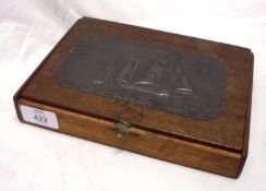 A small Oak Artist’s Box, the top decorated with Arts & Crafts type hammered pewter plaque with