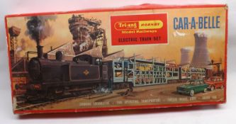 A Tri-ang Hornby Train Set, Car-A-Belle 00-Gauge Boxed Train Set comprises a Smoking Loco; two Car