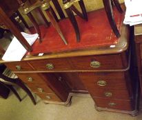 A small Victorian Mahogany Twin Pedestal Desk, with central red leather inset, fitted with nine