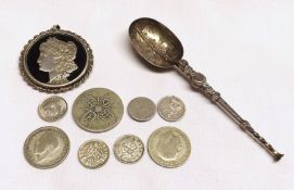 A Mixed Lot comprising: a Pendant cut from an 1887 USA Dollar; a Novelty 20th Century Jam Spoon in