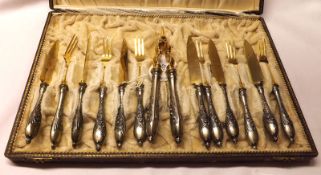 An unusual Set of Six Each Continental Silver Gilt Dessert Knives and Forks, and accompanying