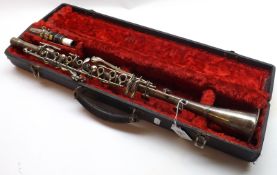 An unmarked white metal American Marching Band Clarinet, with mouthpiece, housed within original