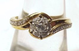 A hallmarked 9ct Gold all small Brilliant Cut Set Diamond Cluster Ring of flower head crossover