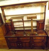 An 18th Century style Large Oak Dresser, the back with pierced frieze over three shelves and two