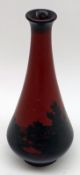 A Royal Doulton Flambé narrow necked Tapering Vase, decorated with a continuous rural scene with