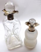 A Mixed Lot comprising: a Clear Glass Dimple Whisky Decanter; a Ribbed Glass Spirit Decanter with